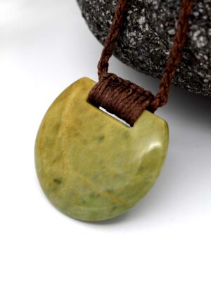 Small Notched Raukaraka Pounamu Disc - Amber Dawn